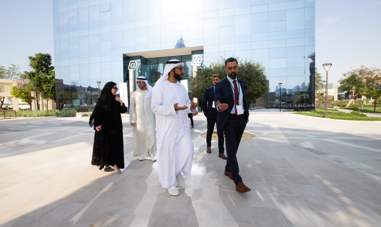 Outdoor walk past a glass office building, Dubai