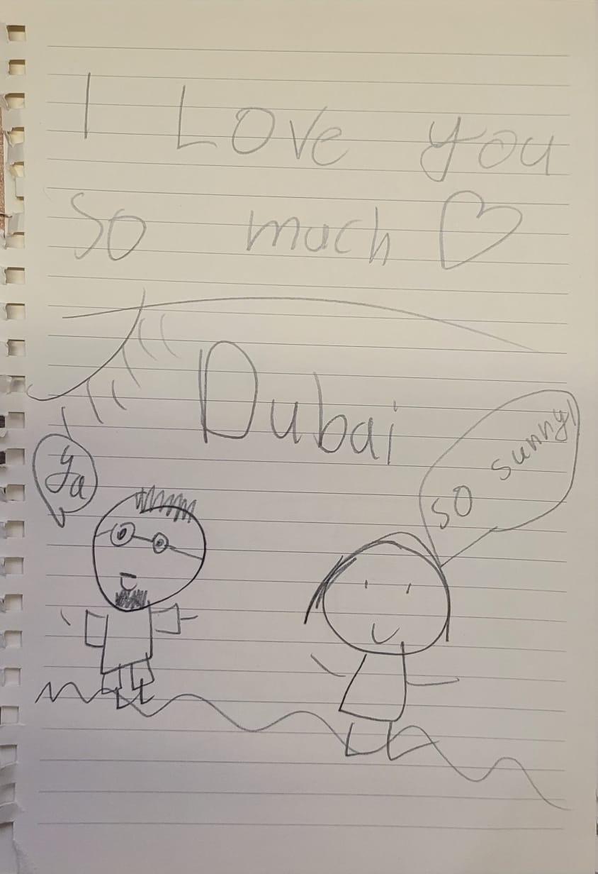 A drawing of two figures with the words 'I love you so much,' Dubai