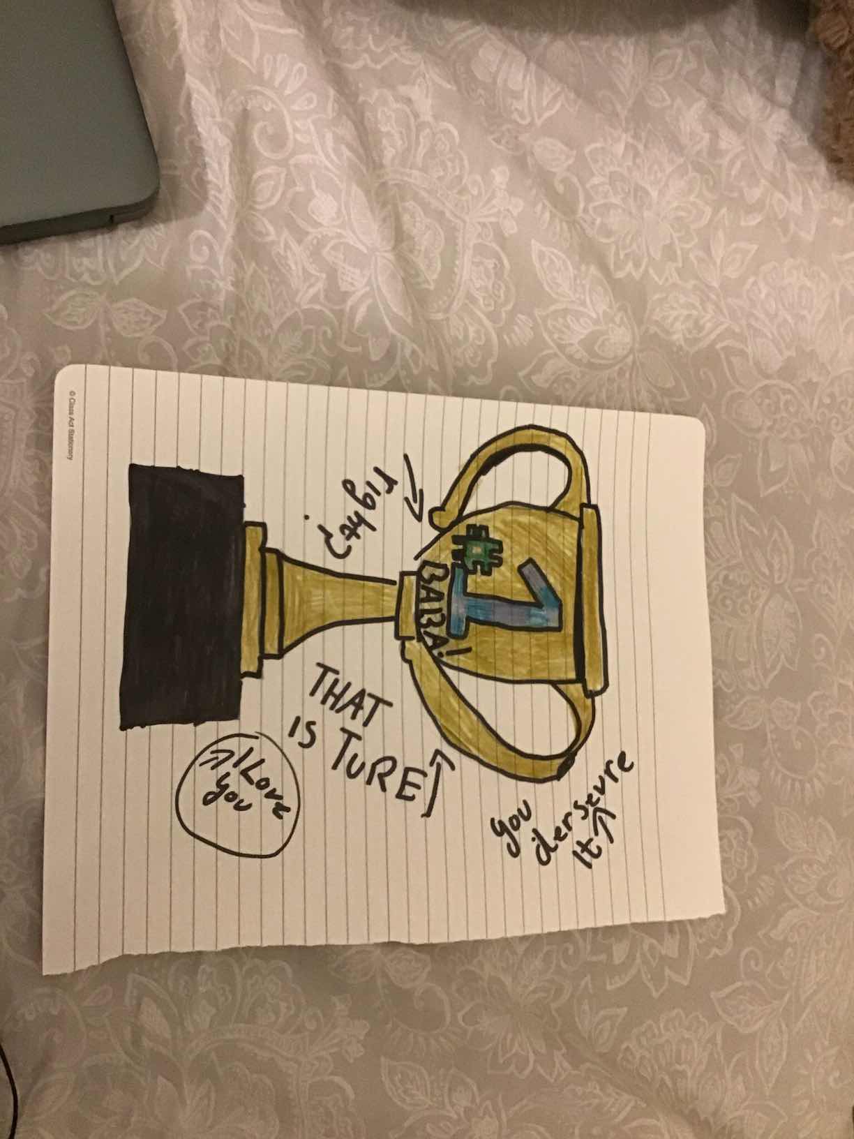 A hand-drawn trophy, 'Best Father,' from one of my daughters